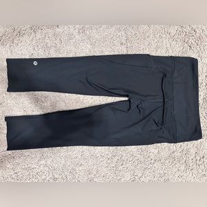 Lululemon Fast and Free high rise tights size 4 Black w/ pockets. 23”
